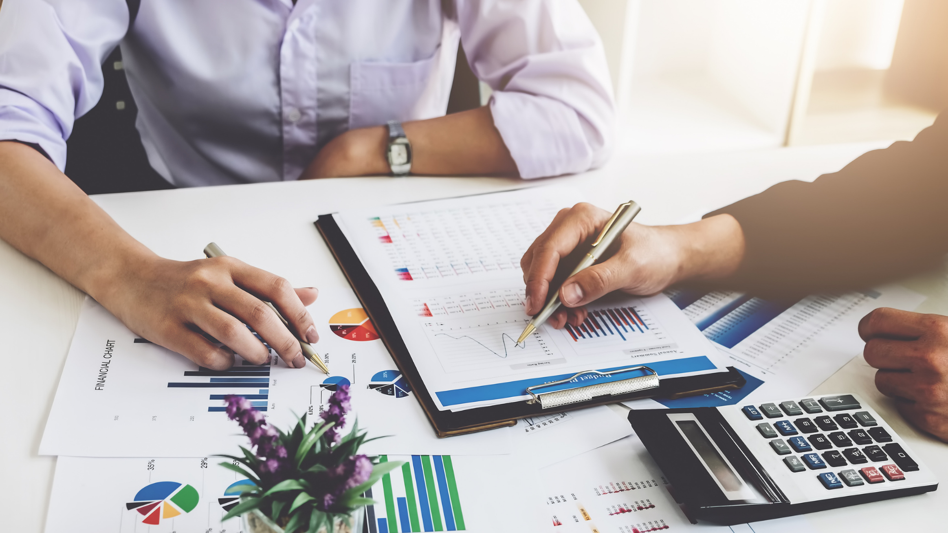 Man and woman preparing financial plans